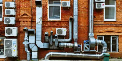 a building with a bunch of pipes on the side of it