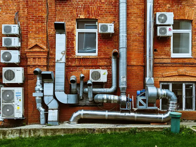 a building with a bunch of pipes on the side of it